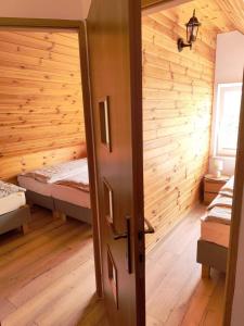 Postel nebo postele na pokoji v ubytování Domki Zagroda