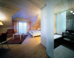 A bed or beds in a room at Seiser Alm Urthaler