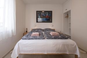 Posteľ alebo postele v izbe v ubytovaní Apartments Lovorik