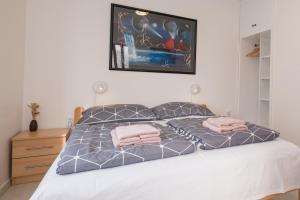 Posteľ alebo postele v izbe v ubytovaní Apartments Lovorik