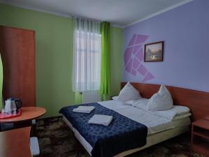 Postel nebo postele na pokoji v ubytování Mieszko centrum przy deptaku