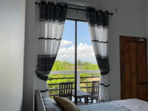 Postel nebo postele na pokoji v ubytování Passi Nature Villas Passikudah