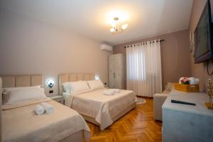 Postel nebo postele na pokoji v ubytování Hotel Pepe
