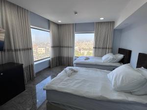 Rúm í herbergi á Mount of Olives Hotel