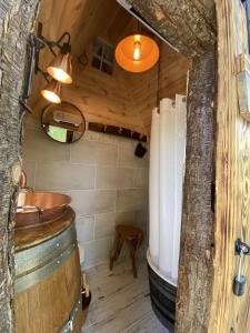 a bathroom with a tub and a sink in a room at Mas Del Flor in Villelongue-dels-Monts