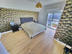 Postel nebo postele na pokoji v ubytování 713-Villa du Roz-Grand confort