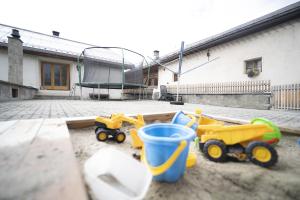 a group of toys sitting in a courtyard at Chasa Riatsch in Ardez