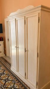 a pair of white cabinets in a room at villa verde sul mare in Vietri sul Mare