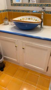 a bathroom counter with a bowl on top of it at villa verde sul mare in Vietri sul Mare