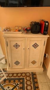 a white cabinet in a room with at villa verde sul mare in Vietri sul Mare