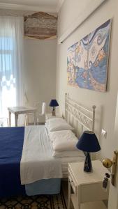 Posteľ alebo postele v izbe v ubytovaní villa verde sul mare
