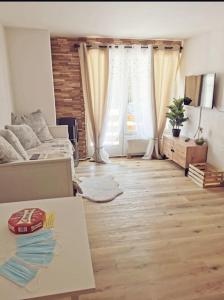Posezení v ubytování Charmant appartement balcon et parking