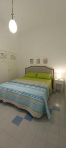 Postel nebo postele na pokoji v ubytování Villa Maria in Puglia con pineta vicino al mare