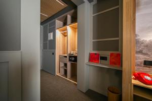 a walk in closet with a red object in it at Hotel La Pau in Barcelona