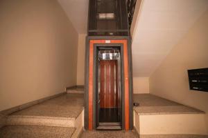 a elevator in the middle of a stair case at Davids Room Palazzo Tamborino in Lecce