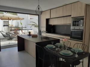a kitchen with a table with plates on it at ALOJAMIENTO EN CULLERa in Cullera