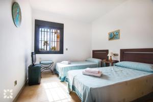 A bed or beds in a room at Villa Sapphire by Abahana Villas