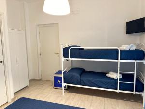 a room with two bunk beds in a room at Mareluna Bed and Breakfast in Marina di Camerota