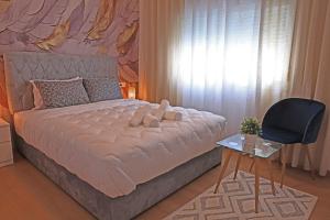 Postel nebo postele na pokoji v ubytování Hotel La Casa Blanca