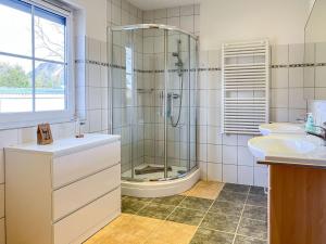 a bathroom with a shower and a sink at Weststrandläufer in Wieck