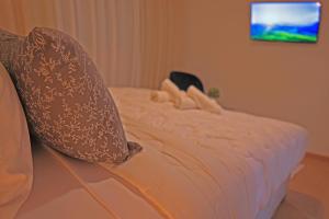 Postel nebo postele na pokoji v ubytování Hotel La Casa Blanca