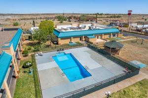 an overhead view of a swimming pool at a resort at Quality Inn in Tucumcari