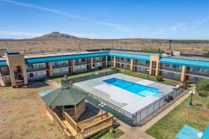 an overhead view of a building with a swimming pool at Quality Inn in Tucumcari