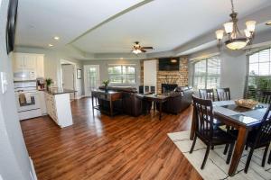 a kitchen and living room with a table and a dining room at Tanglewood Resort, Ascend Hotel Collection in Pottsboro