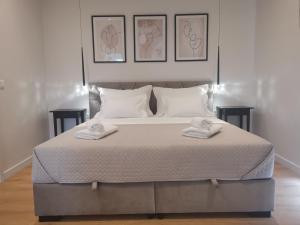 Un pat sau paturi într-o cameră la Villa Kora - luxury holiday Apartments
