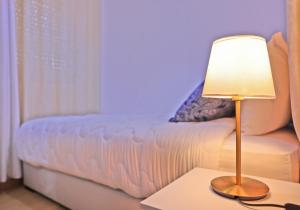 Postel nebo postele na pokoji v ubytování Hotel La Casa Blanca