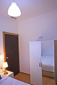 Postel nebo postele na pokoji v ubytování Hotel La Casa Blanca