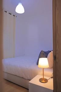 Postel nebo postele na pokoji v ubytování Hotel La Casa Blanca