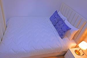 Postel nebo postele na pokoji v ubytování Hotel La Casa Blanca