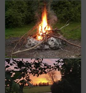 a fire pit in the middle of a field at Natur, Wasser und Landleben - Camping mit eigenem Zelt in Bechhofen