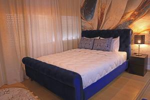 Postel nebo postele na pokoji v ubytování Hotel La Casa Blanca