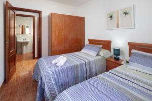 Ένα ή περισσότερα κρεβάτια σε δωμάτιο στο Apartamento Dayca