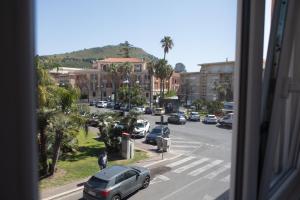 a view from a window of a street with cars at Affittacamere Piazza Mazzini in Terracina