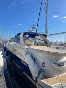 a boat is docked at a dock in a harbor at Bateau Cranchi 47 Méditerranée 1150cv in Cannes