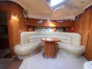 a small room with a table in a boat at Bateau Cranchi 47 Méditerranée 1150cv in Cannes