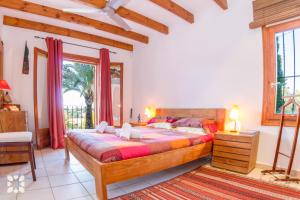 A bed or beds in a room at Villa Sandro by Abahana Villas