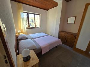 Posteľ alebo postele v izbe v ubytovaní Apartmani Origo