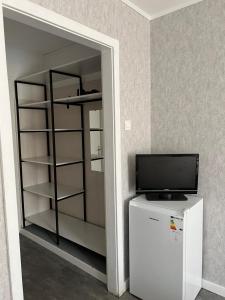 TV a/nebo společenská místnost v ubytování Legacy Hotel + 16 fotografií