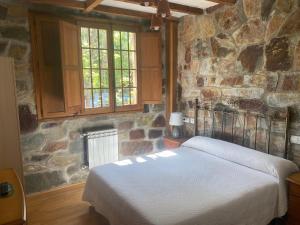 Posteľ alebo postele v izbe v ubytovaní Hotel Rural Camino Medulas + 37 fotografií