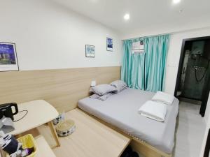 Nap Hella Inn客房内的一张或多张床位