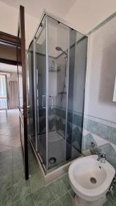 a bathroom with a shower and a toilet and a sink at Casa Vacanza Villa Romano in Nicolosi +43 photos