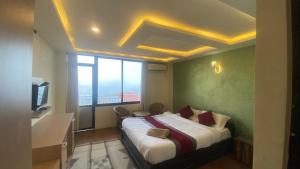 Cama o camas de una habitación en Himalayan Sunrise