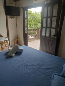 Cama ou camas em um quarto em Pousada Martin Pescador Bombinhas