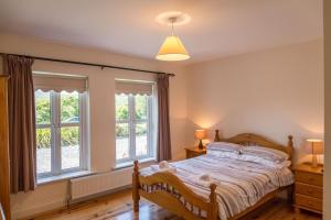 Säng eller sängar i ett rum på Ballinakill Lodge