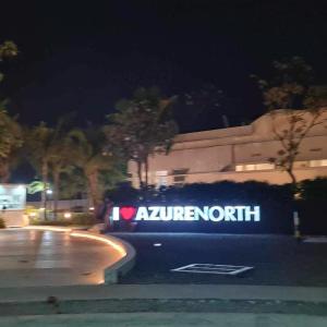 a car parked on the side of a street at night at Elitista Chateau Azure North Pampanga in San Fernando +8 photos