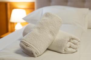Postel nebo postele na pokoji v ubytování Szinbád Hotel